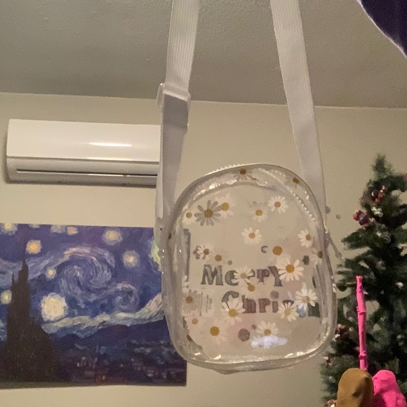 Small, cute bag with daisies on it fits 12 to 9 stuff Great for kids. - Picture 3 of 6